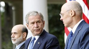 President Bush stares down the Secretary of the Treasurer Henry Paulson